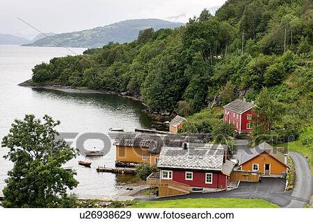 Stock Photo - Houses at waterfront, Hardanger, Hardangerfjord, Hardangervidda, Hardanger, Norway. Fotosearch