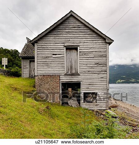 Stock Photo - Log cabin at the riverside, Hardangervidda, Hardanger, Norway. Fotosearch