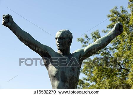 Stock Image - Low angle view of a statue in Gustav Vigeland Sculpture Park, Frogner Park, Oslo, Norway. Fotosearch