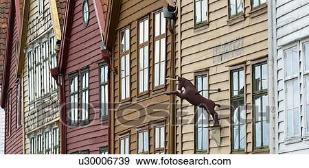 Stock Photo - Low angle view of a unicorn statue on a building, Bryggen, Bergen, Norway. Fotosearch