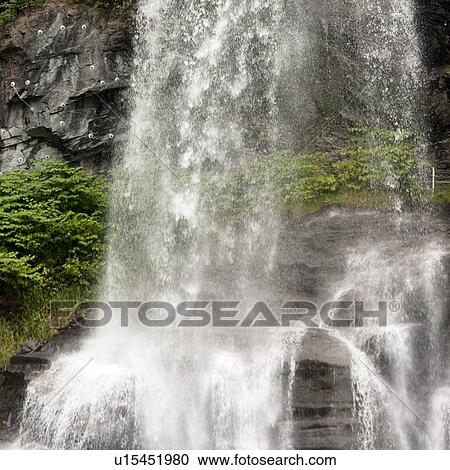 Stock Image - Low angle view of a waterfall, Steinsdalsfossen, Norheimsund, Hardangervidda, Hardanger, Norway. Fotosearch