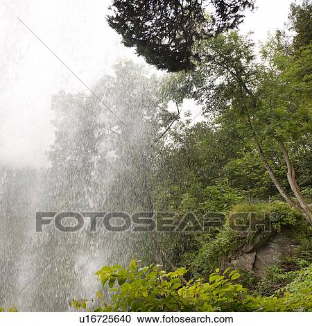 Stock Image - Low angle view of a waterfall, Steinsdalsfossen, Norheimsund, Hardangervidda, Hardanger, Norway. Fotosearch