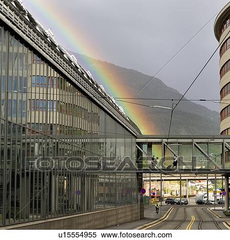 Stock Photography - Rainbow over a city, Norway. Fotosearch