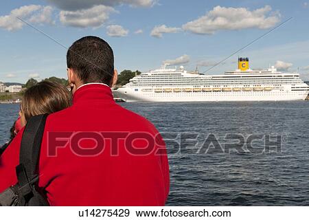 Rear view of a couple with a cruise ship in the background, Oslofjord, Oslo Harbor, Oslo, Norway View Large Photo Image Stock Photo - Rear view of a couple with a cruise ship in the background, Oslofjord, Oslo Harbor, Oslo, Norway. Fotosearch