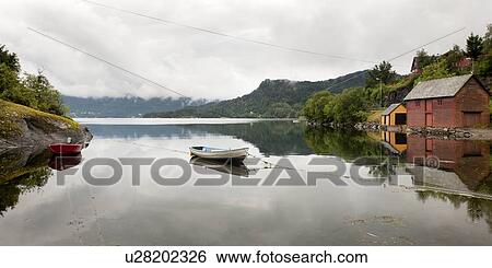 Reflection of a boat in water, Bjorn Fjord, Hardangervidda, Hardanger, Norway View Large Photo Image Stock Photograph - Reflection of a boat in water, Bjorn Fjord, Hardangervidda, Hardanger, Norway. Fotosearch