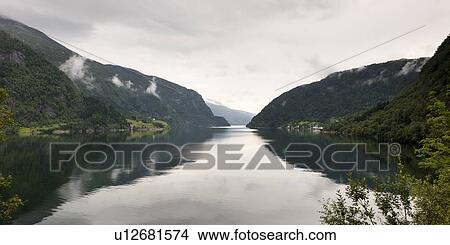 Picture - Reflection of mountains in the lake, Granvinsvatnet, Granvin, Hordaland County, Norway. Fotosearch