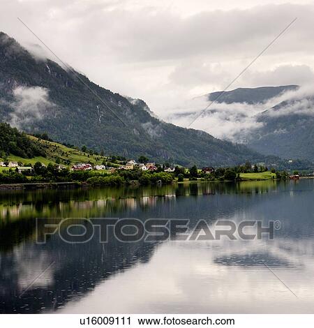 Stock Image - Reflection of mountains on water, Granvinsvatnet, Granvin, Hordaland County, Norway. Fotosearch