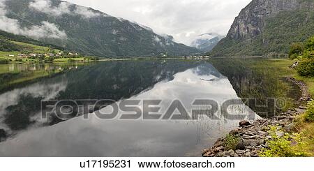 Stock Image - Reflection of mountains on water, Granvinsvatnet, Granvin, Hordaland County, Norway. Fotosearch