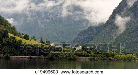 Stock Image - Reflection of mountains on water, Granvinsvatnet, Granvin, Hordaland County, Norway. Fotosearch