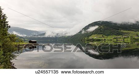 Reflection of mountains on water, Granvinsvatnet, Granvin, Hordaland County, Norway View Large Photo Image Stock Photography - Reflection of mountains on water, Granvinsvatnet, Granvin, Hordaland County, Norway. Fotosearch