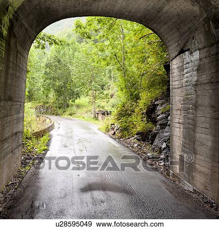 Road passing through a tunnel, Hardangervidda, Hardanger, Norway View Large Photo Image Stock Photo - Road passing through a tunnel, Hardangervidda, Hardanger, Norway. Fotosearch