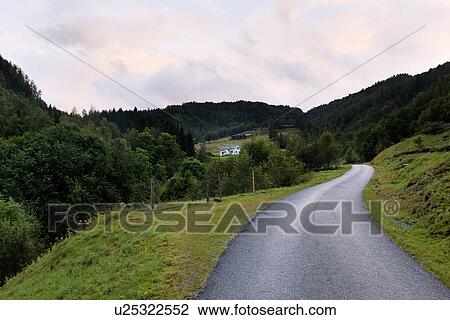 Stock Image - Road passing through mountains, Norway. Fotosearch