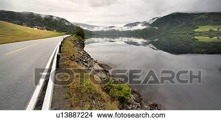 Road passing through mountains, Granvinsvatnet, Granvin, Hordaland County, Norway View Large Photo Image Picture - Road passing through mountains, Granvinsvatnet, Granvin, Hordaland County, Norway. Fotosearch