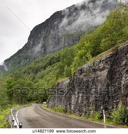 Stock Photo - Road passing through mountains, Hardangervidda, Hardanger, Norway. Fotosearch