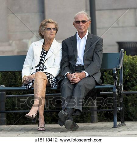 Stock Image - Senior couple sitting on a bench, Oslo, Norway. Fotosearch