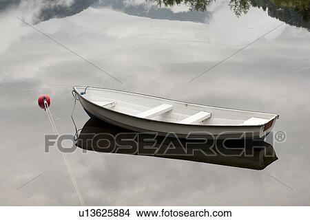 Picture - Small boat in the lake, Granvinsvatnet, Granvin, Hordaland County, Norway. Fotosearch