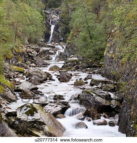 Picture - Stream flowing through rocks, E16, Norway. Fotosearch