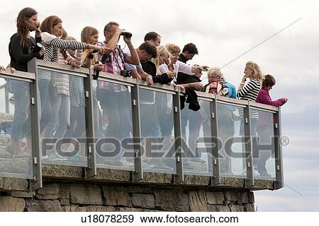 Stock Photo - Tourists at a harbor, Floyen Mountain, Bergen, Norway. Fotosearch