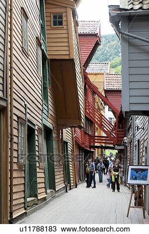 Tourists in a street, Bryggen, Bergen, Norway View Large Photo Image Stock Image - Tourists in a street, Bryggen, Bergen, Norway. Fotosearch
