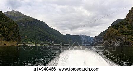 Wake in a Fjord made from a moving boat, Balestrand, Sognefjord, Norway View Large Photo Image Stock Photograph - Wake in a Fjord made from a moving boat, Balestrand, Sognefjord, Norway. Fotosearch