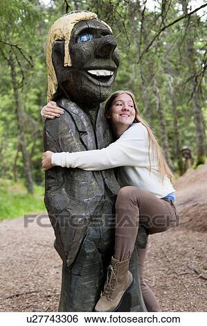 Woman hugging a Troll sculpture in a park, Bergen, Norway View Large Photo Image Stock Photograph - Woman hugging a Troll sculpture in a park, Bergen, Norway. Fotosearch