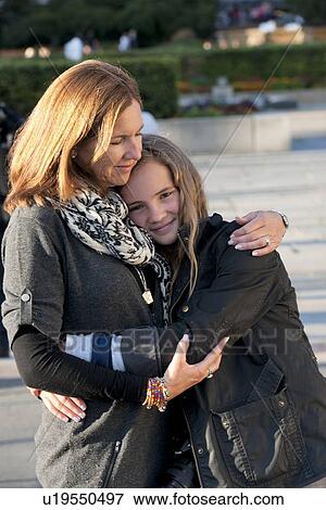 Woman hugging her daughter, Oslo, Norway View Large Photo Image Stock Photo - Woman hugging her daughter, Oslo, Norway. Fotosearch