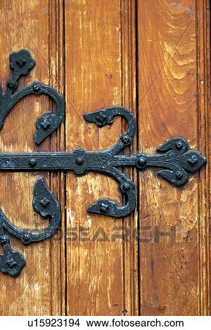 Picture - Wrought iron on a wooden door, Bergen, Norway. Fotosearch