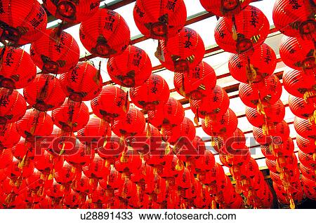 Stock Image - Chinese lanterns hanging in a temple. Fotosearch
