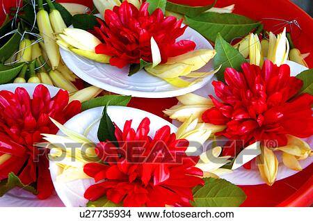 Picture - Close-up of religious offerings at a market stall. Fotosearch