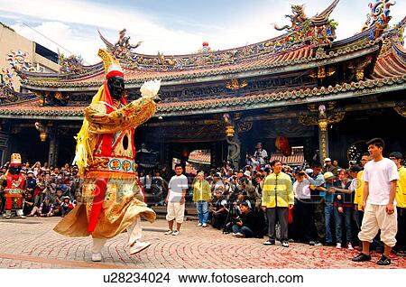 People watching performer performing in front of temple View Large Photo Image Picture - People watching performer performing in front of temple. Fotosearch