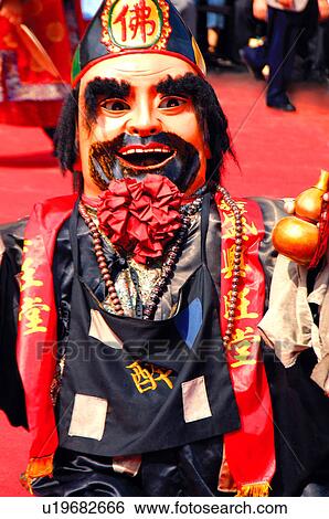 Performer in costume standing on a street View Large Photo Image Stock Photograph - Performer in costume standing on a street. Fotosearch
