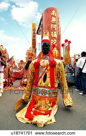 Stock Image - Performer performing in Chinese festival. Fotosearch