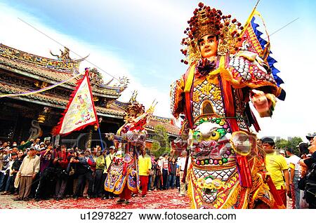 Performer performing in front of temple View Large Photo Image Stock Photo - Performer performing in front of temple. Fotosearch
