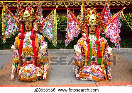 Stock Photograph - Performers performing in Chinese festival. Fotosearch