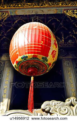 Stock Image - Chinese lantern hanging in a temple. Fotosearch
