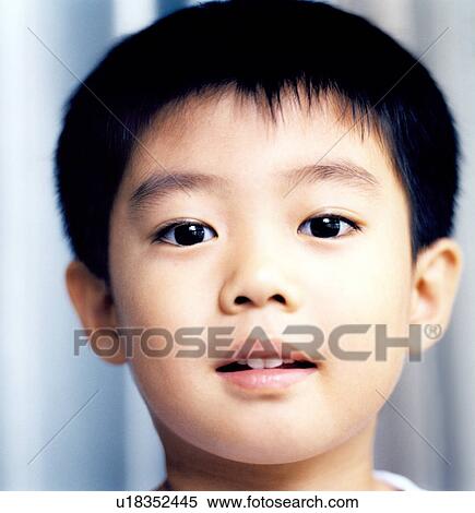 Close-up of a boy posing View Large Photo Image Stock Photography - Close-up of a boy posing. Fotosearch