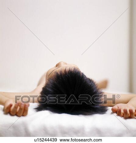 Stock Photo - Close-up of a boy sleeping on the bed. Fotosearch