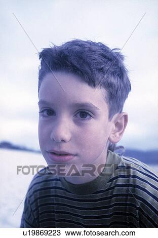 Close-up of a boy thinking on the beach View Large Photo Image Stock Image - Close-up of a boy thinking on the beach. Fotosearch