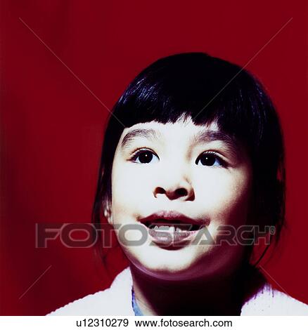 Close-up of a girl smiling View Large Photo Image Stock Photo - Close-up of a girl smiling. Fotosearch