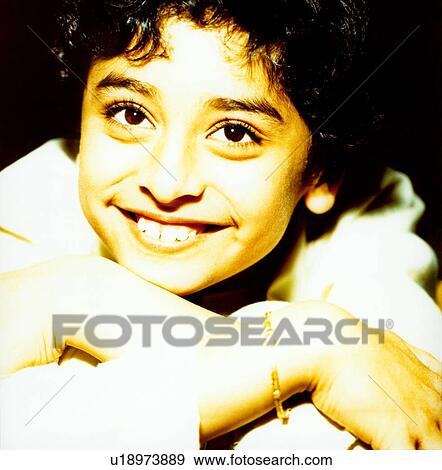 Close-up of a girl smiling View Large Photo Image Stock Photo - Close-up of a girl smiling. Fotosearch