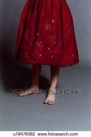 Low section view of a girl wearing frock View Large Photo Image Stock Image - Low section view of a girl wearing frock. Fotosearch