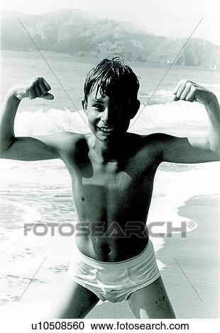 Portrait of a boy playing on the beach View Large Photo Image Stock Image - Portrait of a boy playing on the beach. Fotosearch