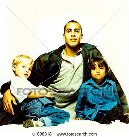 Father sitting with his son and daughter View Large Photo Image Stock Image - Father sitting with his son and daughter. Fotosearch