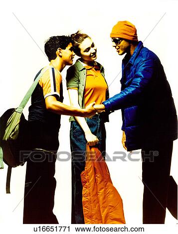 Stock Image - Female fashion model posing with two male fashion models. Fotosearch
