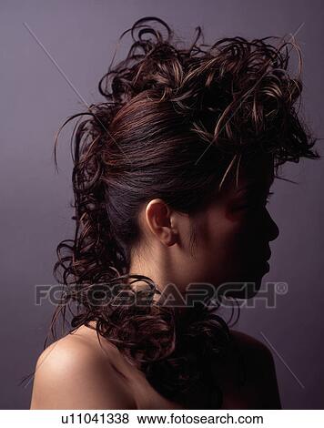 Stock Photo - Female fashion model posing with two male fashion models. Fotosearch