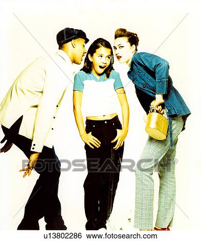 Female fashion model posing with two male fashion models View Large Photo Image Stock Photograph - Female fashion model posing with two male fashion models. Fotosearch
