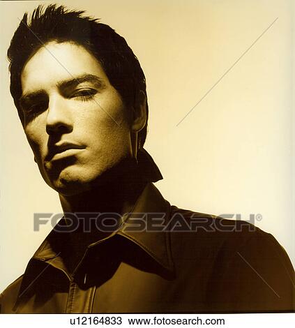 Stock Image - Mid section view of a male fashion model posing. Fotosearch