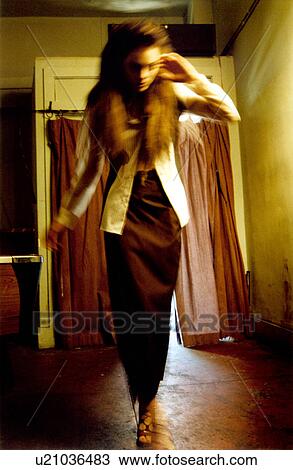 Stock Image - Two female fashion models walking on the ramp. Fotosearch