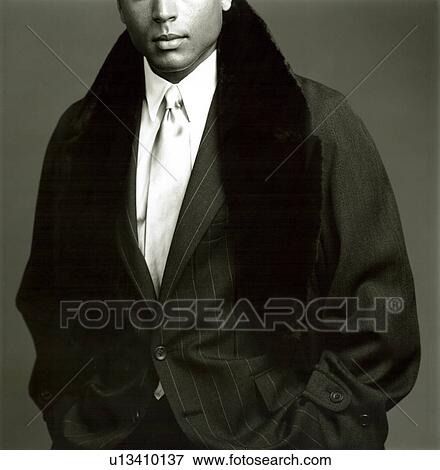 Stock Photo - Two male fashion models sitting. Fotosearch