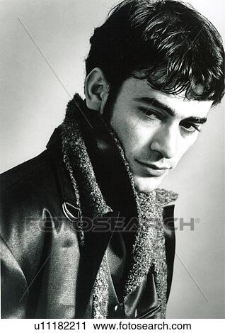 Stock Image - Weight shoot of a male fashion model posing. Fotosearch